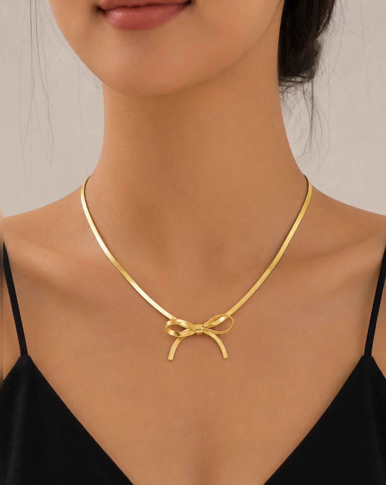 screenshot-30 18K Gold Plated Stainless Steel Bow Necklace - Image 1